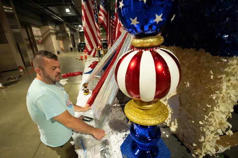 Jeremy Williams, works on a float back stage with the crews of the Fourth of July parade and festival, on floats for the big 4th of July parade, in Philadelphia, June 29, 2026.