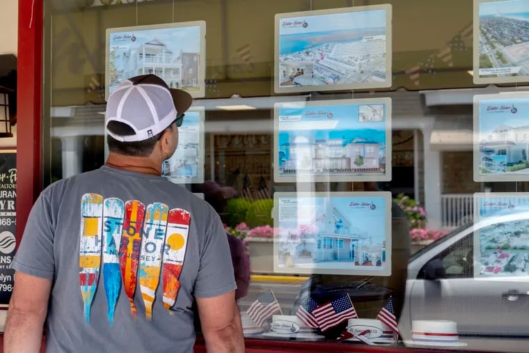 Photographs of rentals in Avalon and Stone Harbor are displayed in the window of Diller Fisher Realtors in downtown Stone Harbor on Sunday, June 11.