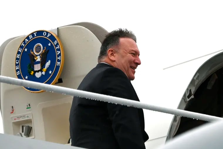 Secretary of State Mike Pompeo, boards a plane as he departs on a multi-country trip, Thursday, Feb. 13, 2020, at Andrews Air Force Base, Md.