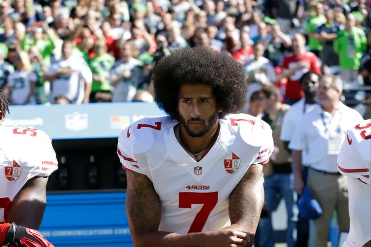 In this  2016, file photo, former San Francisco 49er Colin Kaepernick kneels during the national anthem before an NFL football game to raise awareness about police brutality against African Americans.