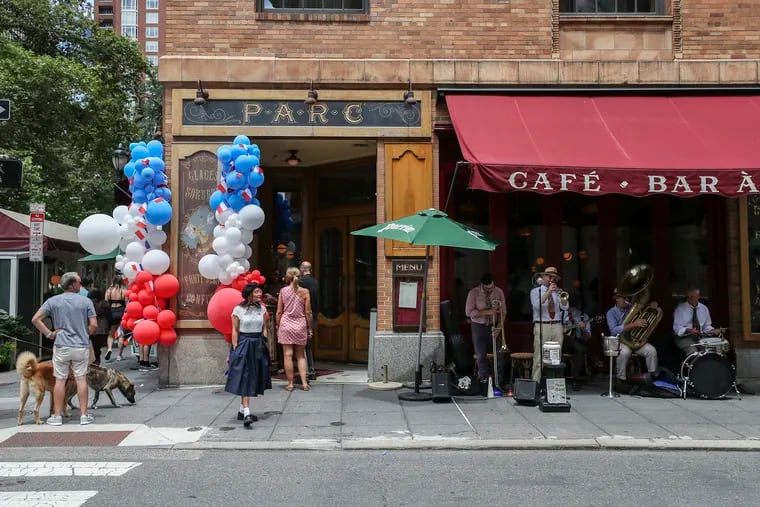 Drew Nugent and the Midnight Society band perform outside of Parc restaurant in the Rittenhouse section of Philadelphia to celebrate Bastille Day on Friday, July 14, 2023.