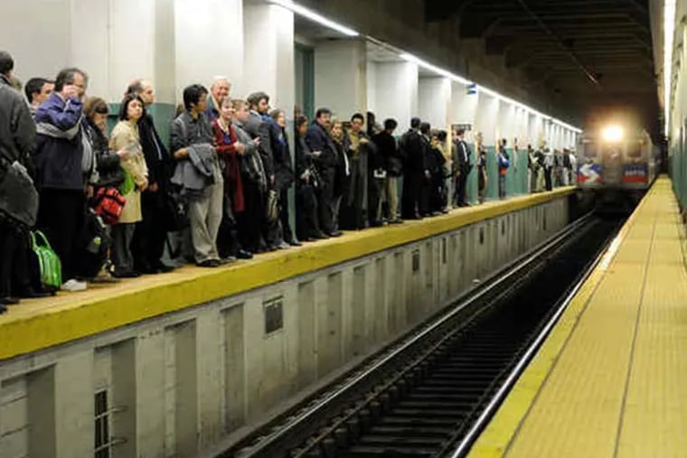 At Suburban Station, a long line of commuters waits for the next Regional Rail train during the last SEPTA strike on Nov. 4, 2009. Upstairs, many waited in long lines for platform access. (KRISTON J. BETHEL / Staff Photographer)
