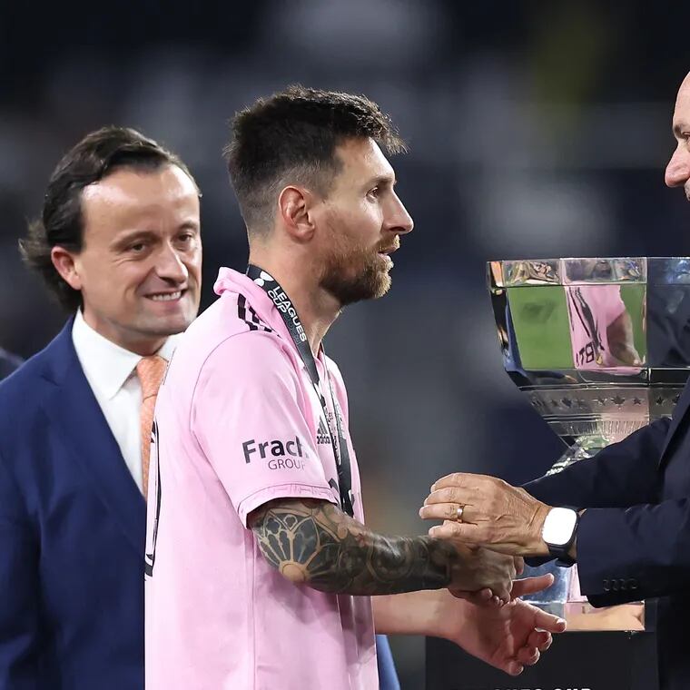 MLS commissioner Don Garber (right) shakes hands with Lionel Messi (center) after Messi helped Inter Miami win last year's Leagues Cup.
