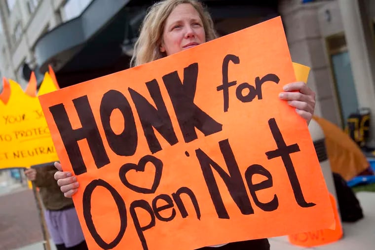 A demonstrator supporting net neutrality outside FCC offices in Washington. Last week, President Obama urged the commission to act.