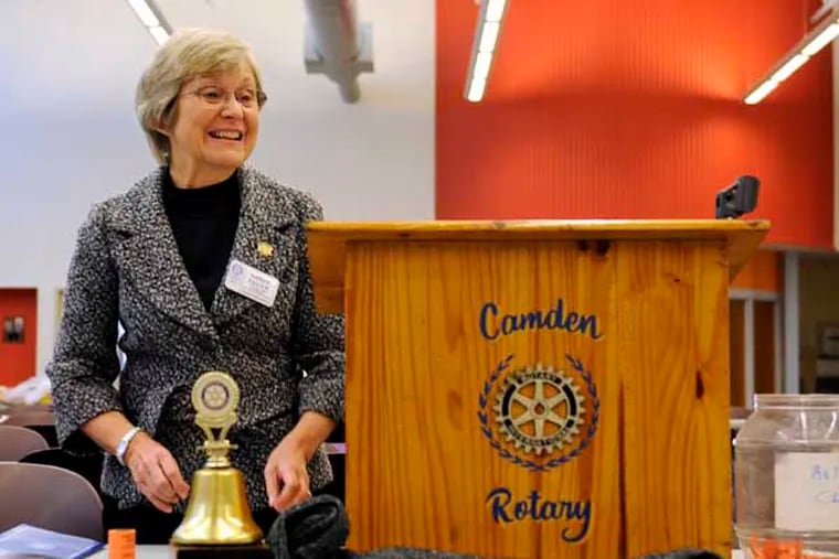 Nancy Gulick, outgoing club president, leads Tuesday morning meeting of the Camden Rotary Club, meeting at Cathedral Kitchen December 4, 212. ( TOM GRALISH / Staff Photographer )
