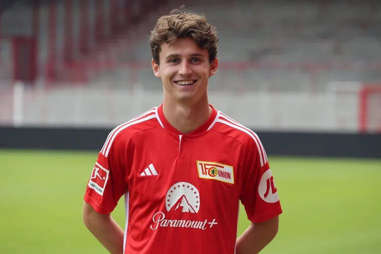 Brenden Aaronson poses in a Union Berlin jersey at the team's presentation before the start of the Bundesliga season.