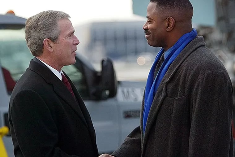 FILE - Former Eagles linebacker and current WIP radio co-host Garry Cobb on Tuesday announced a congressional campaign. Back in 2002 he met with former president George W. Bush at Philadelphia International Airport. (Pablo Martinez Monsivais/AP file photo)