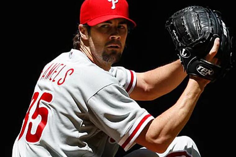 Cole Hamels allowed three earned runs and struck out eight in seven innings on Wednesday. (Ross D. Franklin/AP Photo)
