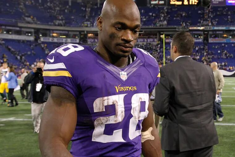 Vikings running back Adrian Peterson (28) walks off the field after an NFL football game against the Green Bay Packers, Sunday, Oct. 27, 2013, in Minneapolis. (Ann Heisenfelt/AP)