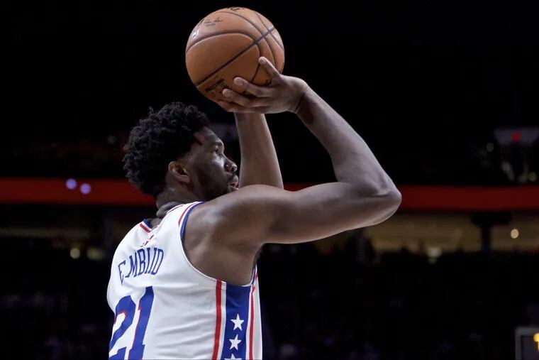 Sixers’ center Joel Embiid shoots against the Portland Trail Blazers during the second half of an NBA basketball game in Portland, Ore., Thursday, Dec. 28, 2017.