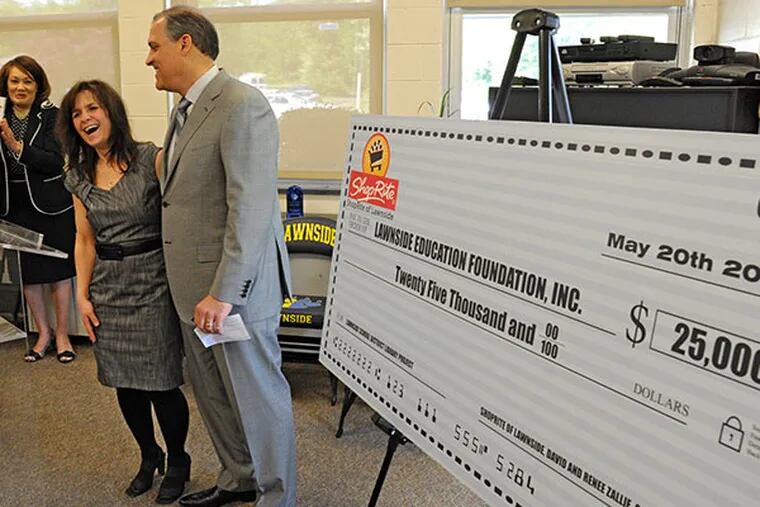 Renee and David Zallie, owners of the Shoprite in Lawnside, NJ, smile and are applauded at a luncheon at Lawnside School for donating $25,000 to the Lawnside Educational Foundation, which helped the Foundation reach its $50,000 fundraising goal. ( CLEM MURRAY / Staff Photographer )