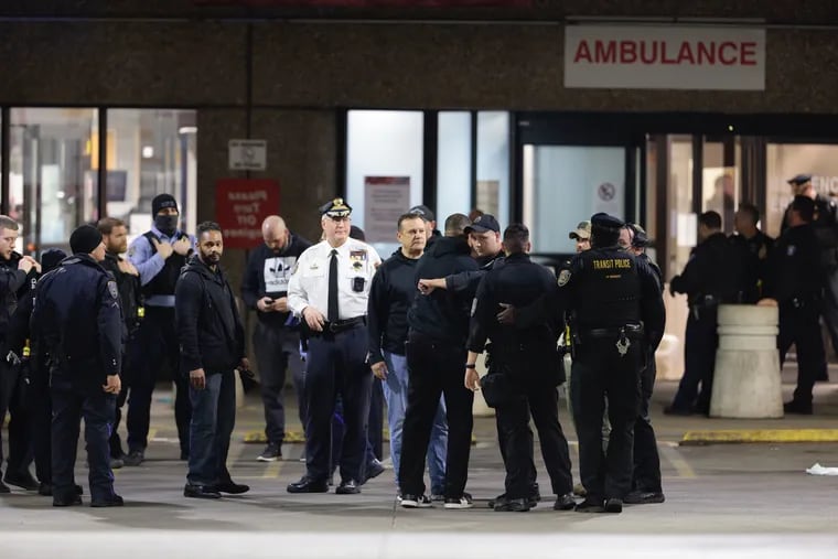 SEPTA police officers gathered outside Temple University Hospital in early April after a transit officer was shot and wounded in Frankford.