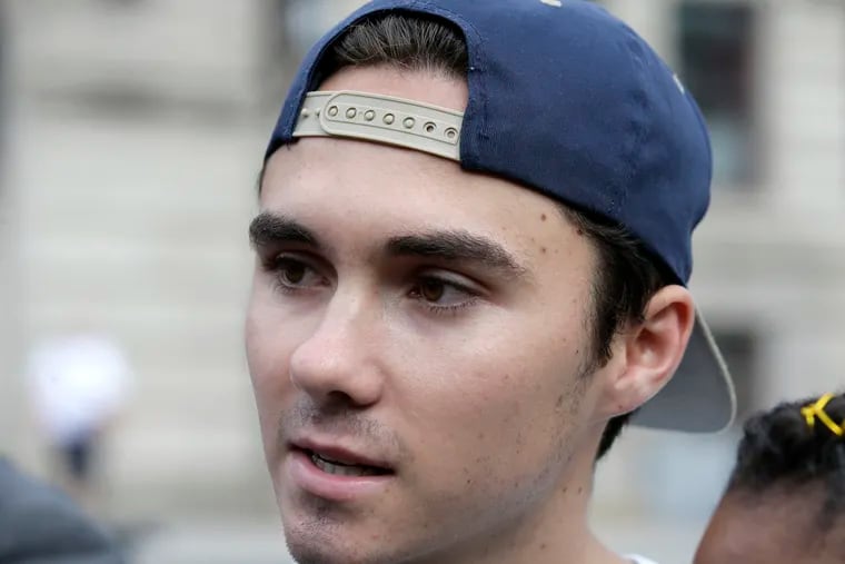 FILE - In this Aug. 23, 2018, file photo, David Hogg, a survivor of the school shooting at Marjory Stoneman Douglas High School, in Parkland, Fla., speaks with reporters before a march in Worcester, Mass. Hogg's remarks during a CNN interview is among those on a Yale Law School librarian's list of the most notable quotes of 2018: "We're children. You guys, like, are the adults. You need to take some action and play a role. Work together, come over your politics and get something done." (AP Photo/Steven Senne, File)