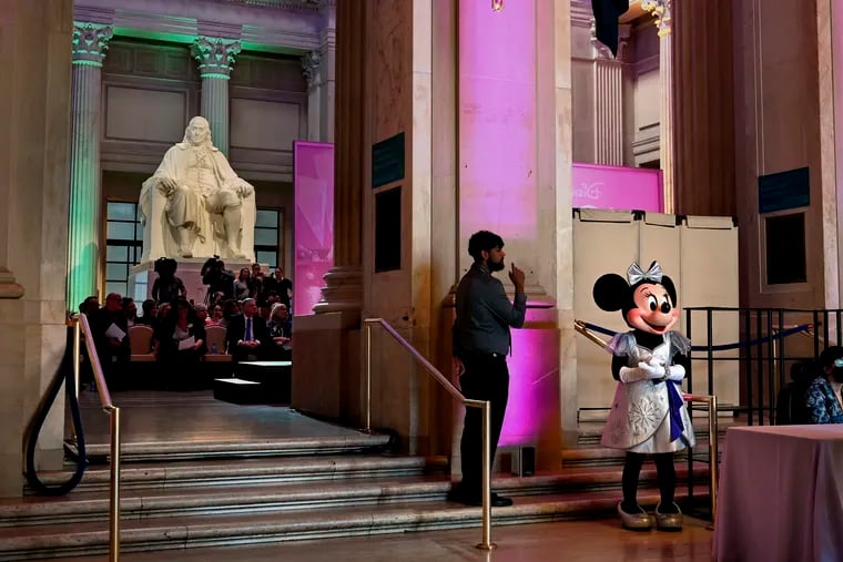Minnie Mouse waits “backstage” at  the Franklin Institute before making her entrance (with Mickey, of course) to cut the ribbon during the preview for the world premiere of "Disney100: The Exhibition," celebrating 100 years of the Walt Disney Co.