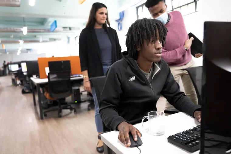 Kenneth Burris works on his computer at Hopeworks in Philadelphia. The nonprofit Hopeworks, which gives young people technology skills training and work experience, is growing its services in Kensington with an expansion of its building thanks to an anonymous $1 million gift.