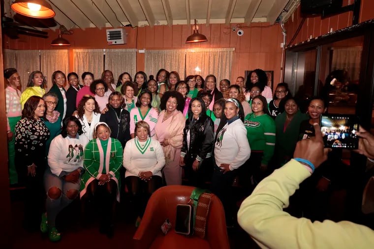 Members of the Alpha Kappa Alpha sorority Omega Mu Omega Chapter gather for a group photo at Relish restaurant, 7152 Ogontz Ave., on Jan. 15, 2023. The group came to Relish to celebrate its 115th Founders Day.