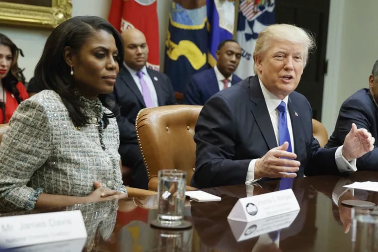 President Donald Trump speaks during a meeting on African American History Month on Feb. 1, 2017 beside former White House staffer Omarosa Manigault Newman.