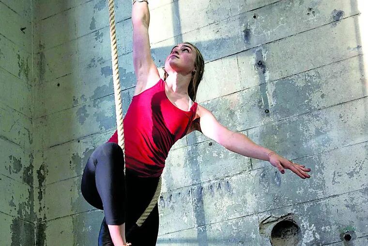 Students at Iron City Circus Arts, such as Bridget Re, learn trapeze and rope exercises.