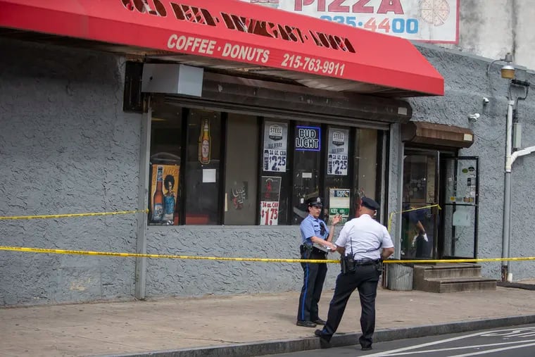 Philadelphia Police and the crime scene unit investigate a shooting that occurred on the 2300 block of Ridge Ave. in Northwest Philadelphia on Saturday, June 15, 2019. Homicides have risen this year in the city.