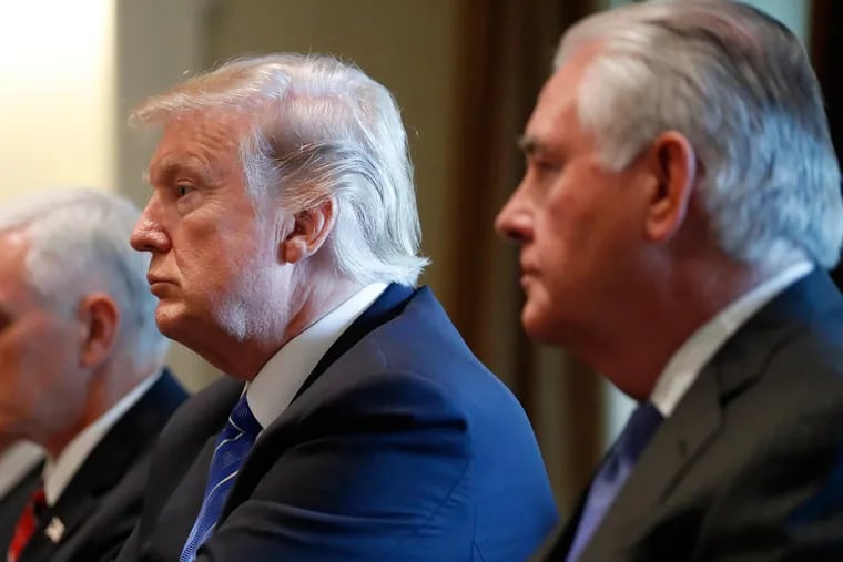 President Trump has reignited a battle with Secretary for State Rex Tillerson (right), this time over IQ points.