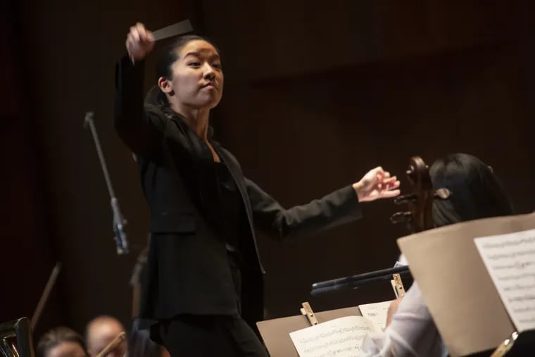 Philadelphia Orchestra assistant conductor Erina Yashima leading the ensemble Friday night at the Mann Center.