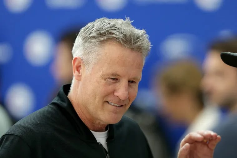 Sixers’ coach Brett Brown talks to reporters during practice at the team’s training complex in Camden, NJ on Friday.