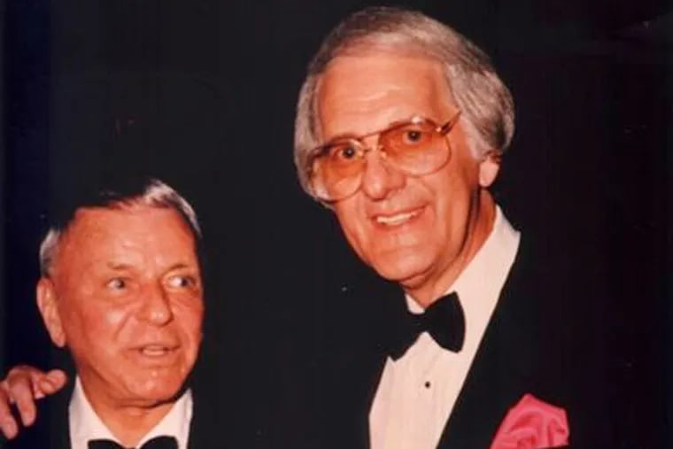 Legendary singer Frank Sinatra (left) stands with his friend and longtime Philadelphia radio host Sid Mark, who shared the singer's work on the airwaves for more than 60 years.