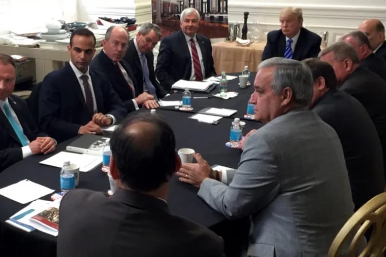 In this photo from President Trump’s Twitter account, George Papadopoulos (second from left) sits at a table with then-candidate Trump and others at what is labeled at a national security meeting in Washington.