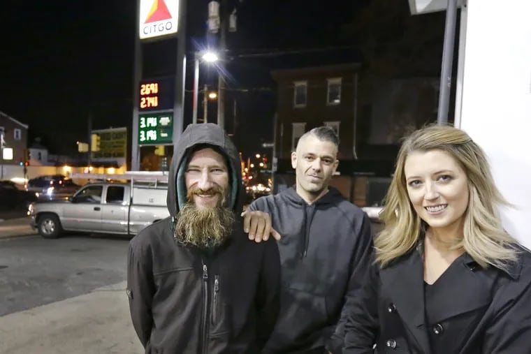 Kate McClure and her boyfriend, Mark D'Amico (center) have not complied with a court mandate to turn over GoFundMe money they raised for Johnny Bobbitt Jr, according to lawyers for the homeless man.