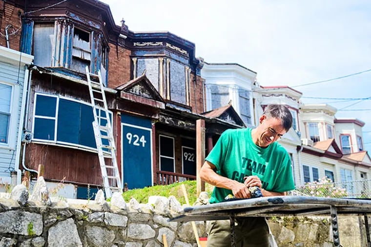 Chris Toepfer is part of a group giving back to 5 neighborhoods with The Neighborhood Foundation by boarding up and polishing 55 abandonded and run-down houses in the span of 4 weeks and with a budget of 25,000 dollars. (VIVIANA PERNOT/Staff Photographer)