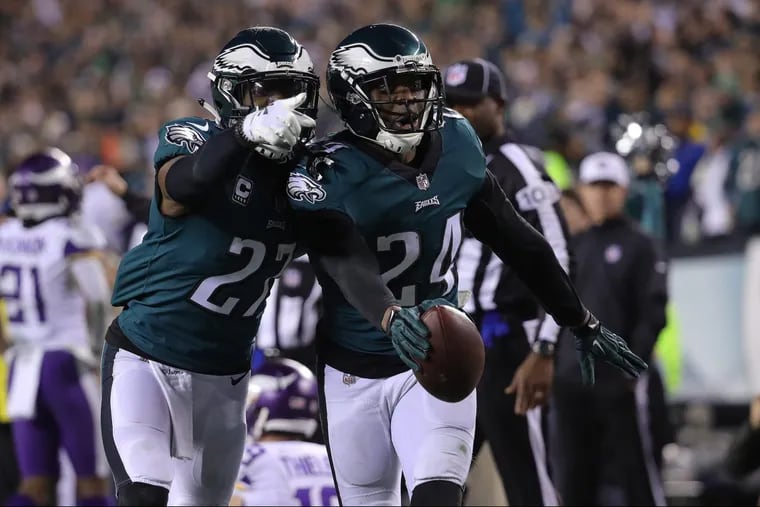 Malcolm Jenkins, left, celebrates after teammate, Corey Graham’s interception in the fourth quarter of the NFC Championship Game win over Minnesota. Strong defensive play will be key if they are to get by Tom Brady.