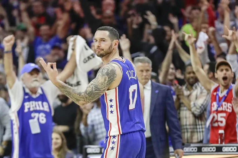 Sixers forward JJ Redick holds up his fingers after making a fourth-quarter three pointer to put away the Pacers on Friday.
