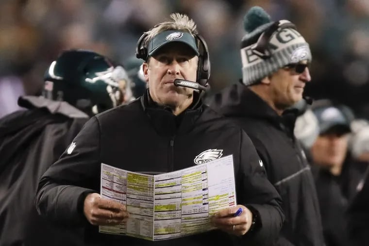 Eagles Head Coach Doug Pederson holds his play chart against the Atlanta Falcons in a NFC Divisional Playoff game on Saturday, January 13, 2018 in Philadelphia. YONG KIM / Staff Photographer