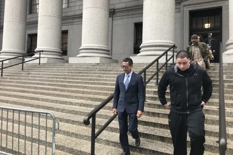 Joey Merlino, wearing a suit and tie, leaves a federal courthouse in New York after pleading guilty to a gambling-related charge on April 27, 2018.