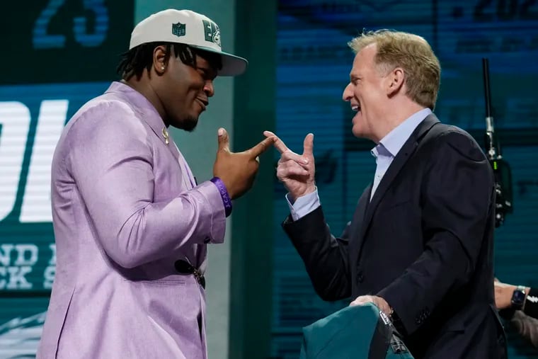 Defensive lineman Jalen Carter (left), reacting with NFL commissioner Roger Goodell after getting drafted, joins a couple of former Georgia teammates in Philly.