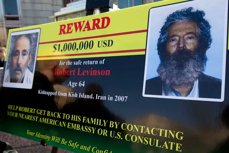 In this 2012 file photo, an FBI poster shows a composite image of former FBI agent Robert Levinson, right, of how he would look like in captivity, left, taken from the video released by his captors in Washington during a news conference. The family of retired FBI agent Levinson said Wednesday that U.S. government officials have concluded that he has died while in the custody of Iran.