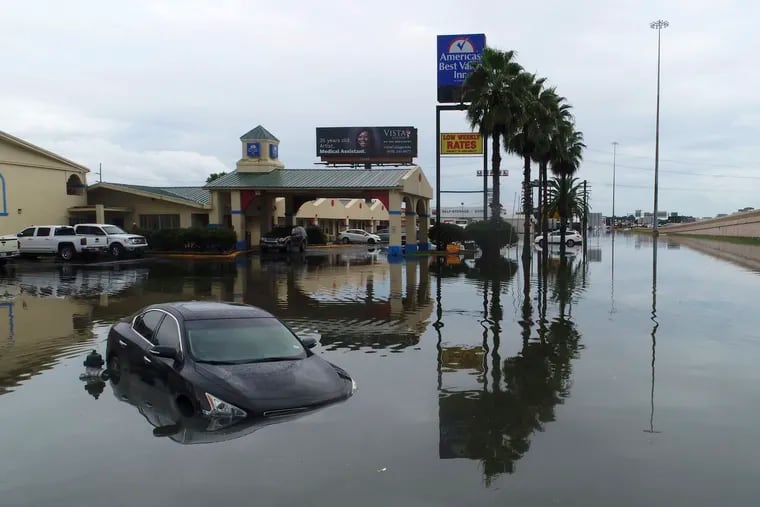 Several cars were flooded along Interstate 10 in Southeast Texas due to Tropical Storm Imelda.