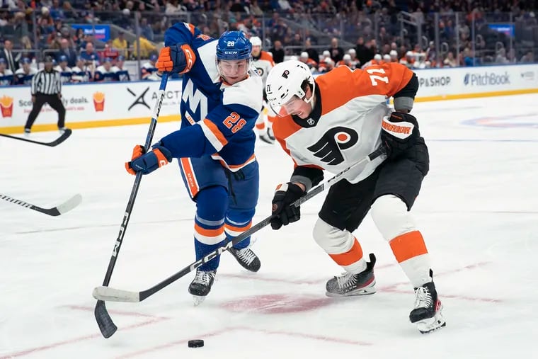 Right wing Tyson Foerster (71) fights for the puck against New York Islanders defenseman Alexander Romanov (28) during the first period on Nov. 25.