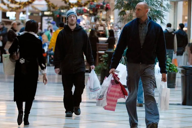 Shoppers at the King of Prussia mall. One economist said consumer spending, two-thirds of the total economy, would probably fall at an annual rate of 2.5 percent to 3 percent in this quarter.