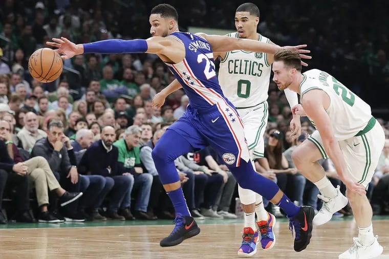 Sixers guard Ben Simmons chases down the loose basketball past Boston Celtics forward Gordon Hayward and forward Jayson Tatum during the second-quarter on Tuesday, October 16, 2018 in Boston.