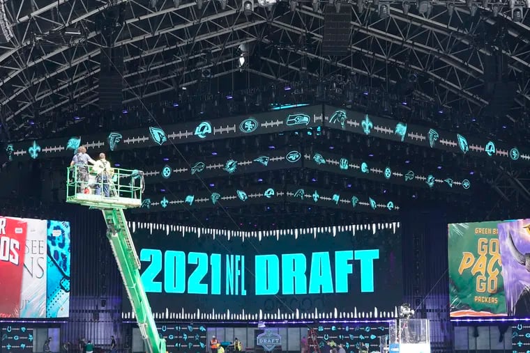 Workers continue preparing the NFL Draft Theatre for the 2021 NFL Draft in Cleveland. Fans seated in the amphitheater must be vaccinated.