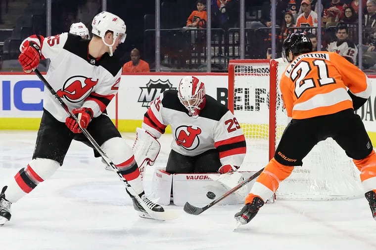 The Flyers' Scott Laughton is stopped by New Jersey Devils goaltender Mackenzie Blackwood. The Devils trounced the Flyers on Thursday night.