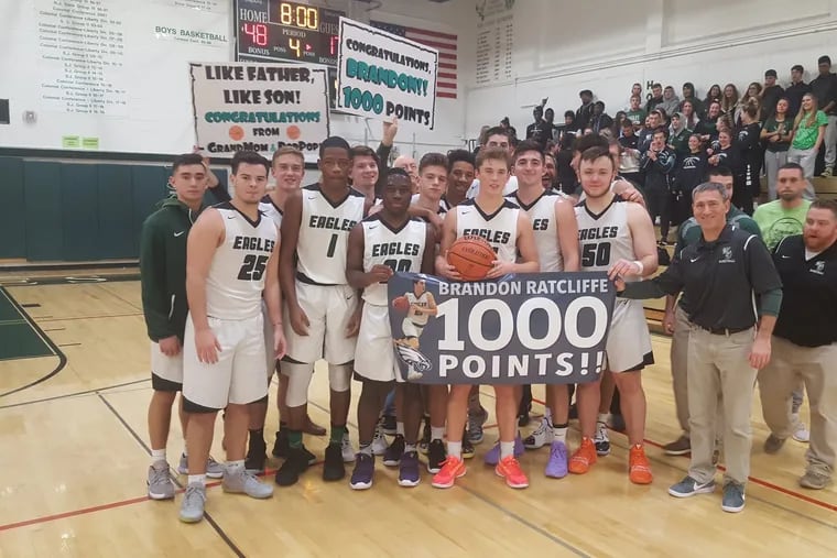 Brandon Ratcliffe is surrounded by teammates and coaches as he scored his 1,000th career point in West Deptford's 62-28 win over Audubon on Dec. 23, 2019.