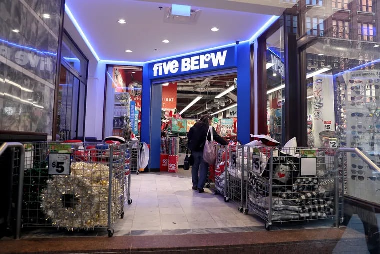 A customer looks at items outside the Five Below store in Philadelphia in November. Five Below sells a Philadelphia map puzzle with strange interpretations of the city’s geography and landmarks. The puzzle’s art was widely criticized on social media.