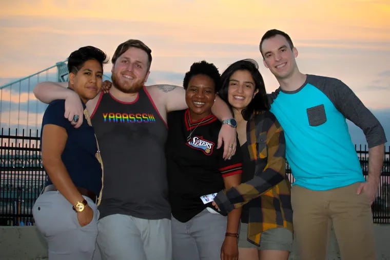 The founding members of Qunify, an LGBTQ+ group that plans events in Philadelphia, stand from left to right: Neha Ghosh (chief events officer), Vincent Scarfo (chief financial officer), Dredeir Roberts (chief communications officer), Sofia Oleas (chief information officer), Eric Schroeckenthaler (chief operating officer).
