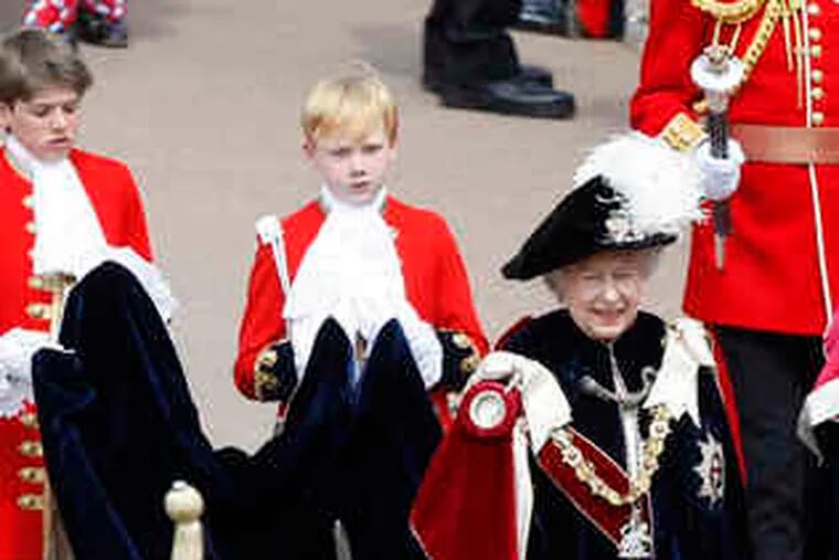 Britain's Queen Elizabeth II taking part in a processionto St. George's Chapel in Windsor, England, yesterday.