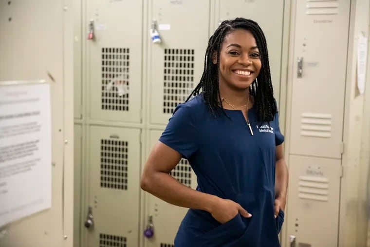 Kamali Thompson posed for a portrait in the locker room at the Fencers Club in New York, New York on Friday, December 6, 2019. The Temple graduate is training for the 2020 Olympics.