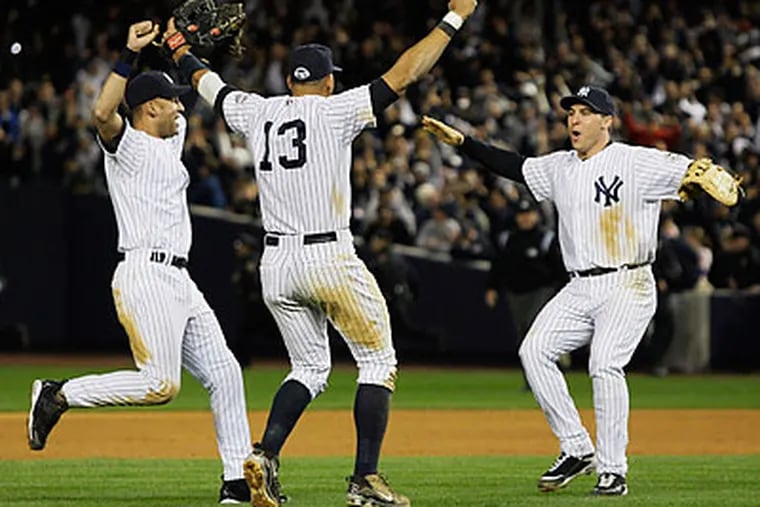 Derek Jeter (left), Alex Rodriguez (center) and Mark Teixieira (right) helped the Yankees reach the World Series for the 40th time with a 5-2 win over the Angels in Game 6 of the ALCS. (Elise Amendola/AP)