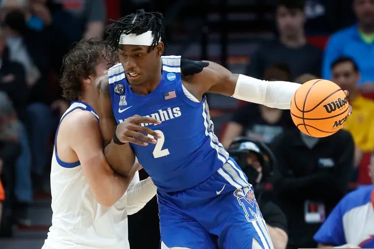 Memphis center Jalen Duren (2) drives past Boise State forward Tyson Degenhart, left, during the first half of a first round NCAA college basketball tournament game March 17 in Portland, Ore.
