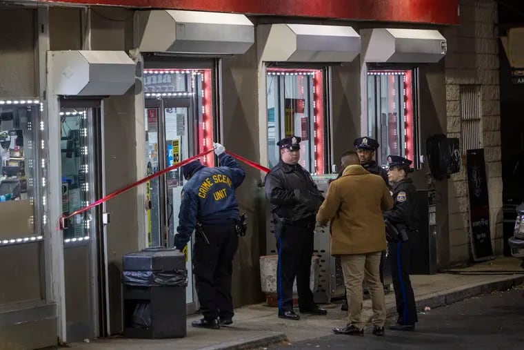 Philadelphia police investigate the shooting death of a store clerk at an Exxon station on the 7100 block of Torresdale Avenue early Tuesday morning.